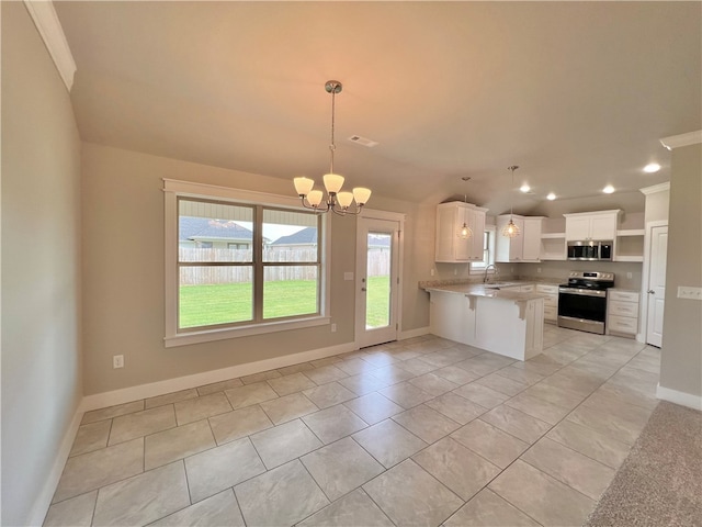 kitchen with white cabinets, appliances with stainless steel finishes, light tile patterned floors, a notable chandelier, and kitchen peninsula