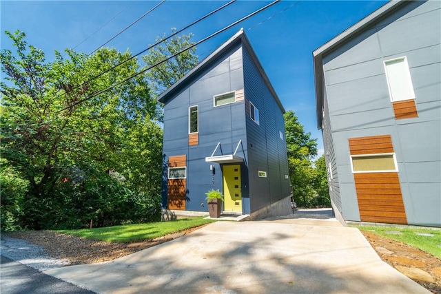 contemporary home featuring driveway