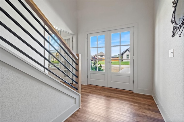 entrance foyer featuring french doors and wood-type flooring