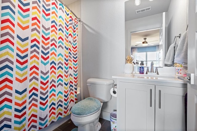 bathroom with ceiling fan, toilet, tile patterned flooring, and vanity