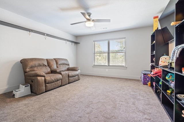 living room featuring ceiling fan and light colored carpet