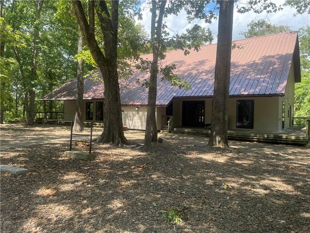 back of house with a wooden deck