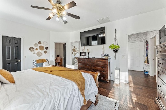 bedroom with dark wood-type flooring and ceiling fan