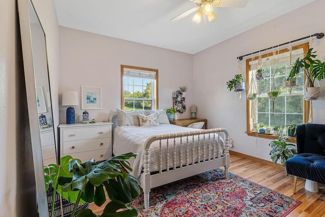 bedroom featuring ceiling fan and light hardwood / wood-style floors