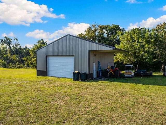 garage featuring a yard