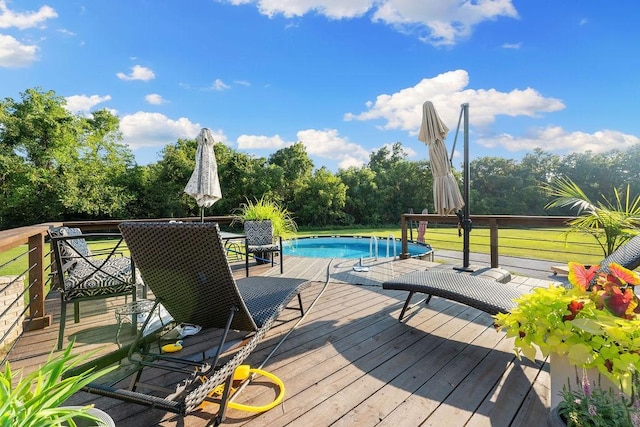 view of swimming pool featuring a wooden deck