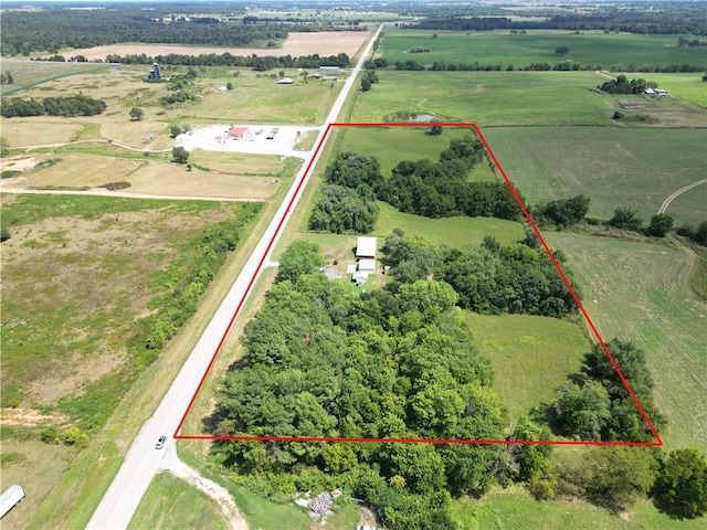 birds eye view of property with a rural view