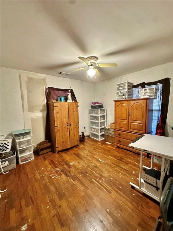 bedroom featuring ceiling fan and hardwood / wood-style floors