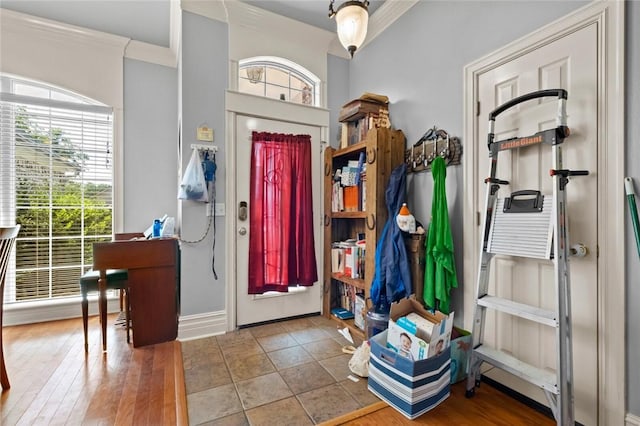 tiled entrance foyer with ornamental molding