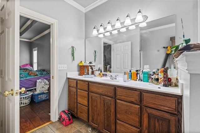 bathroom with ornamental molding, connected bathroom, vanity, and tile patterned floors