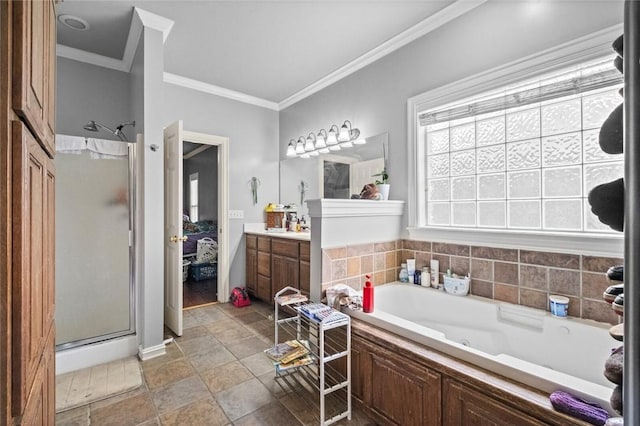 full bathroom with a tub with jets, a stall shower, vanity, and crown molding