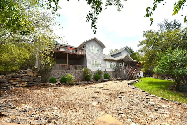 view of side of property with a wooden deck