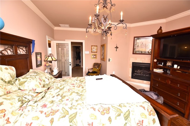 bedroom with crown molding and a notable chandelier