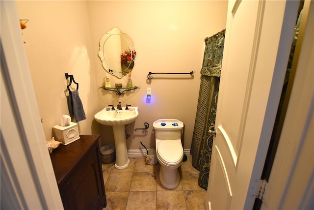 bathroom featuring toilet and tile patterned floors