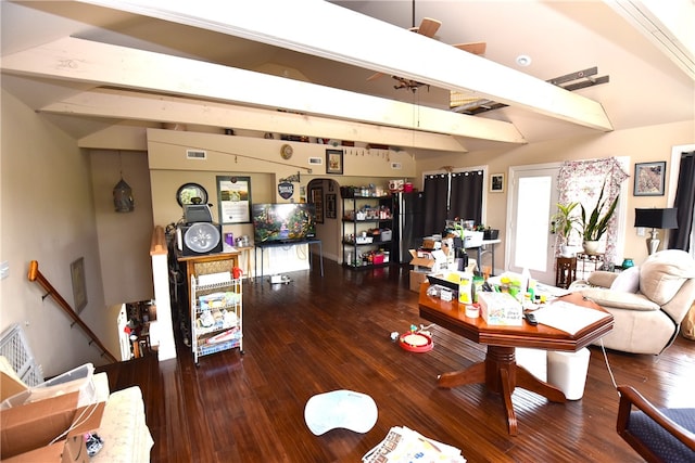 living room featuring vaulted ceiling with beams and hardwood / wood-style flooring