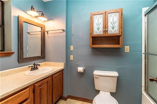 bathroom featuring bath / shower combo with glass door, vanity, and toilet