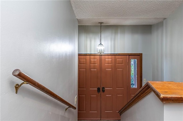 entrance foyer with a textured ceiling