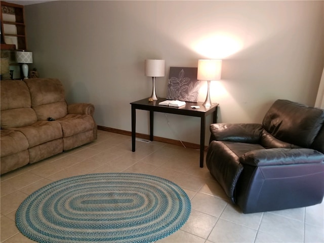 living room with baseboards and tile patterned floors