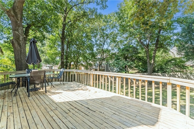 wooden deck with outdoor dining area