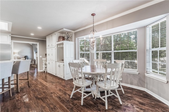 dining room featuring plenty of natural light, ornamental molding, and dark wood-style flooring