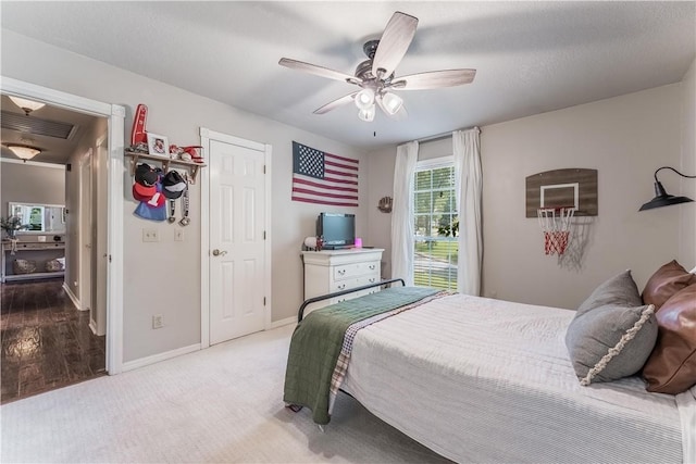 bedroom featuring a ceiling fan, carpet, visible vents, and baseboards