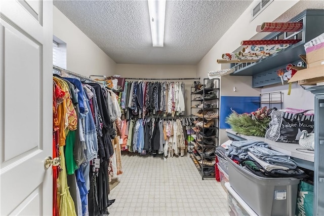 spacious closet featuring tile patterned floors and visible vents