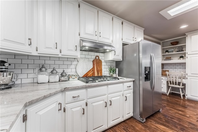 kitchen featuring under cabinet range hood, white cabinets, appliances with stainless steel finishes, and open shelves