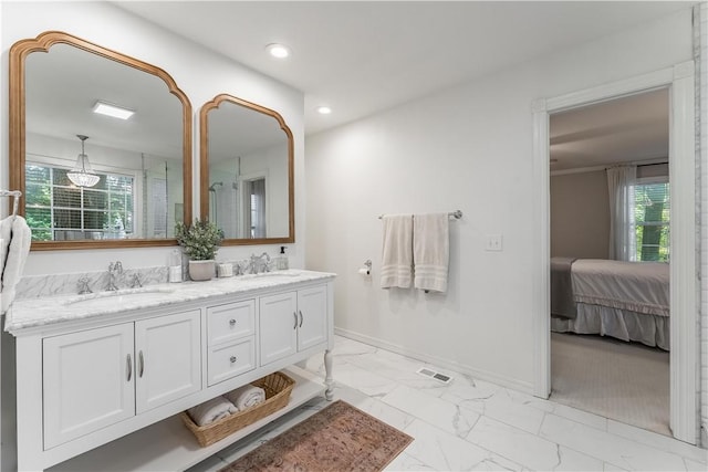 bathroom featuring recessed lighting, baseboards, marble finish floor, and a sink