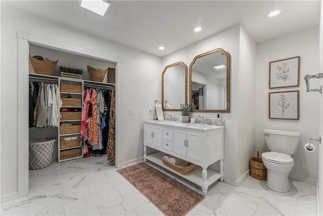 full bathroom featuring recessed lighting, marble finish floor, and a sink