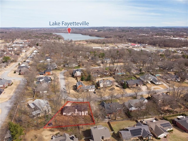 birds eye view of property featuring a residential view and a water view