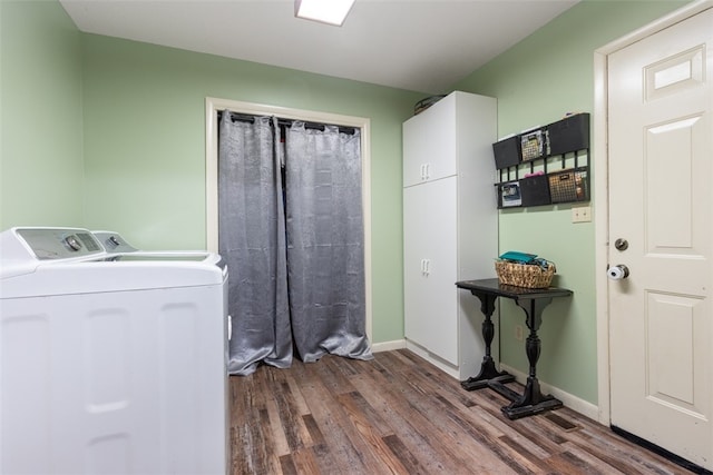 washroom with hardwood / wood-style flooring, cabinets, and separate washer and dryer