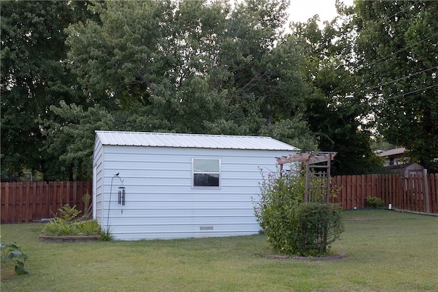 view of outbuilding with a lawn