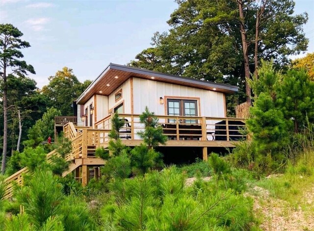 back of property featuring a wooden deck