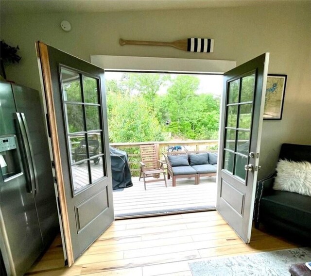 doorway featuring light wood finished floors