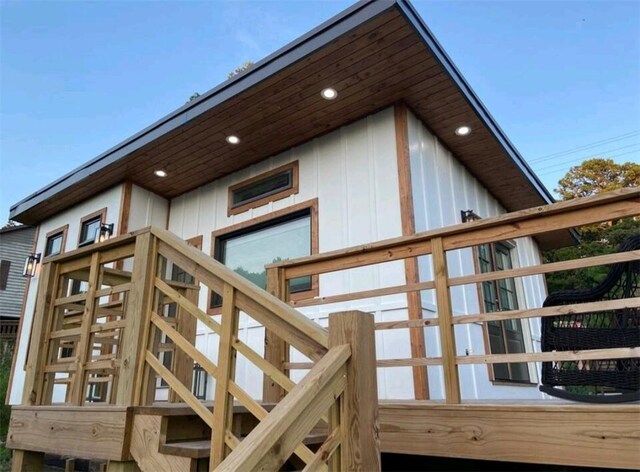 view of property exterior featuring stairway and board and batten siding