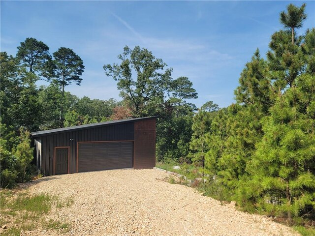 detached garage featuring driveway