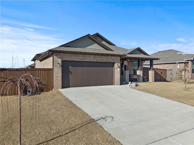 view of front of home with a front yard and a garage