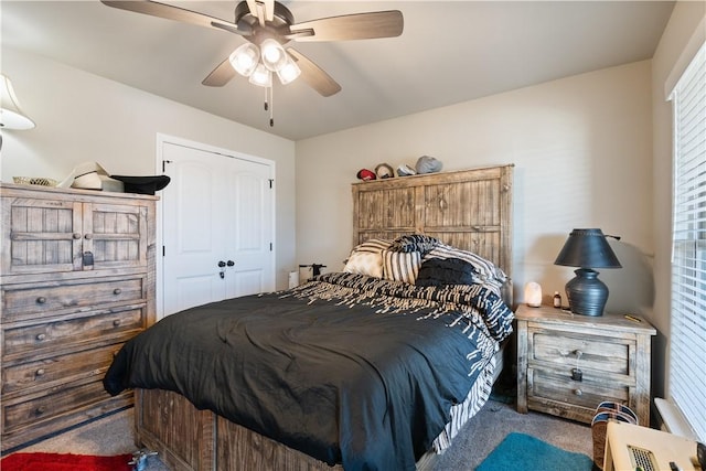 bedroom with ceiling fan, a closet, and carpet