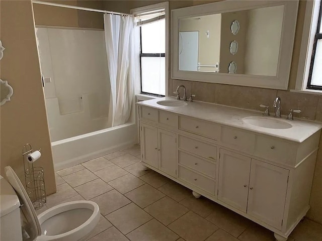 full bathroom featuring shower / tub combo with curtain, tile patterned floors, tasteful backsplash, vanity, and toilet