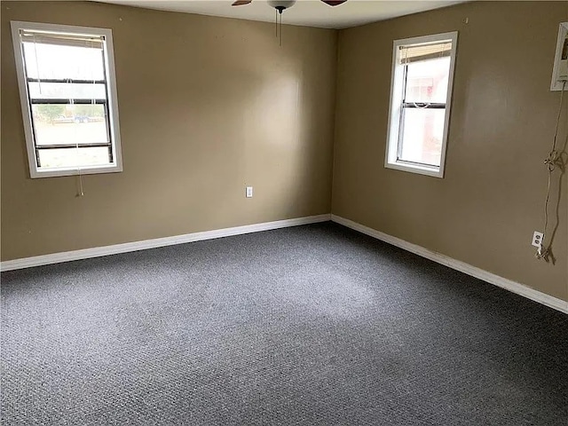 carpeted empty room featuring ceiling fan