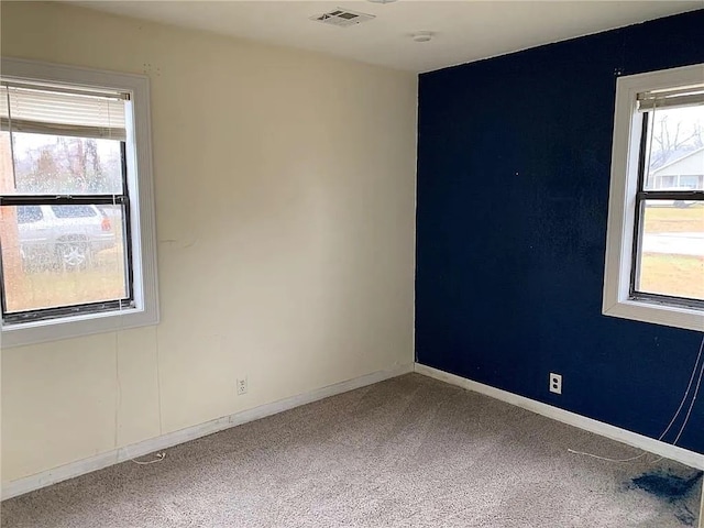 empty room featuring carpet flooring