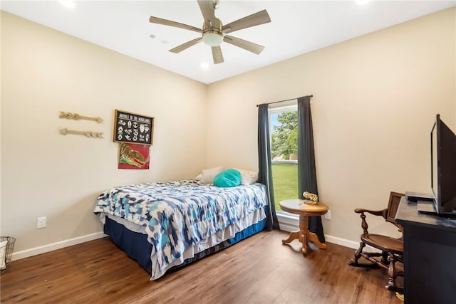 bedroom with ceiling fan and wood-type flooring