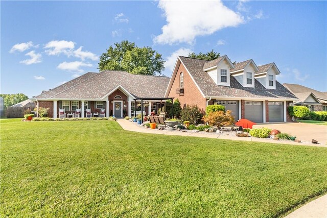 new england style home with a front yard and a garage