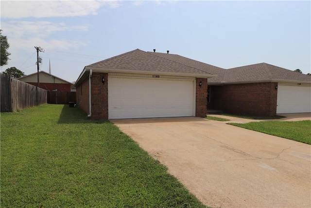 single story home featuring driveway, a front yard, fence, and brick siding