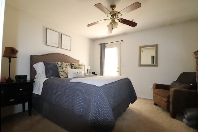 bedroom featuring light colored carpet and ceiling fan