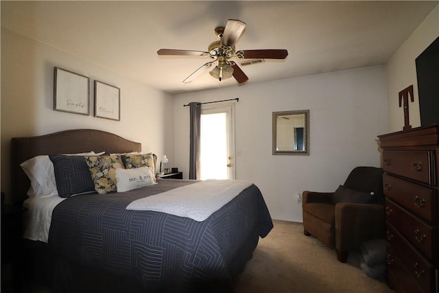 carpeted bedroom with a ceiling fan