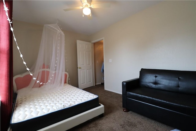 carpeted bedroom featuring a ceiling fan and baseboards