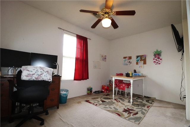 home office featuring carpet floors and a ceiling fan