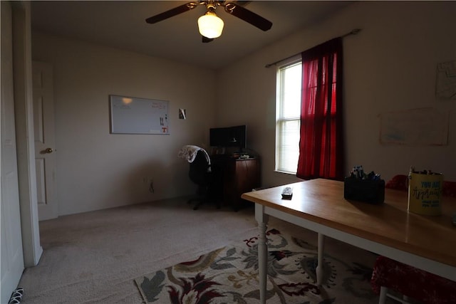 office with light carpet and ceiling fan