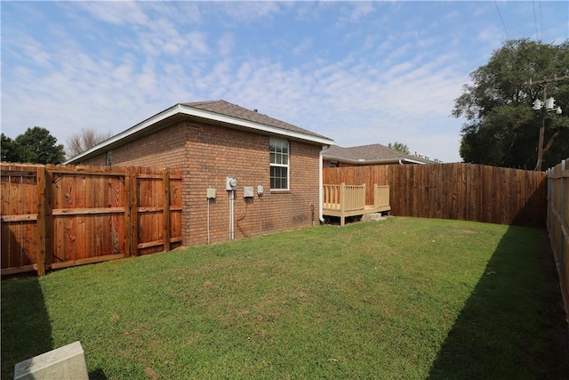 view of yard with a fenced backyard